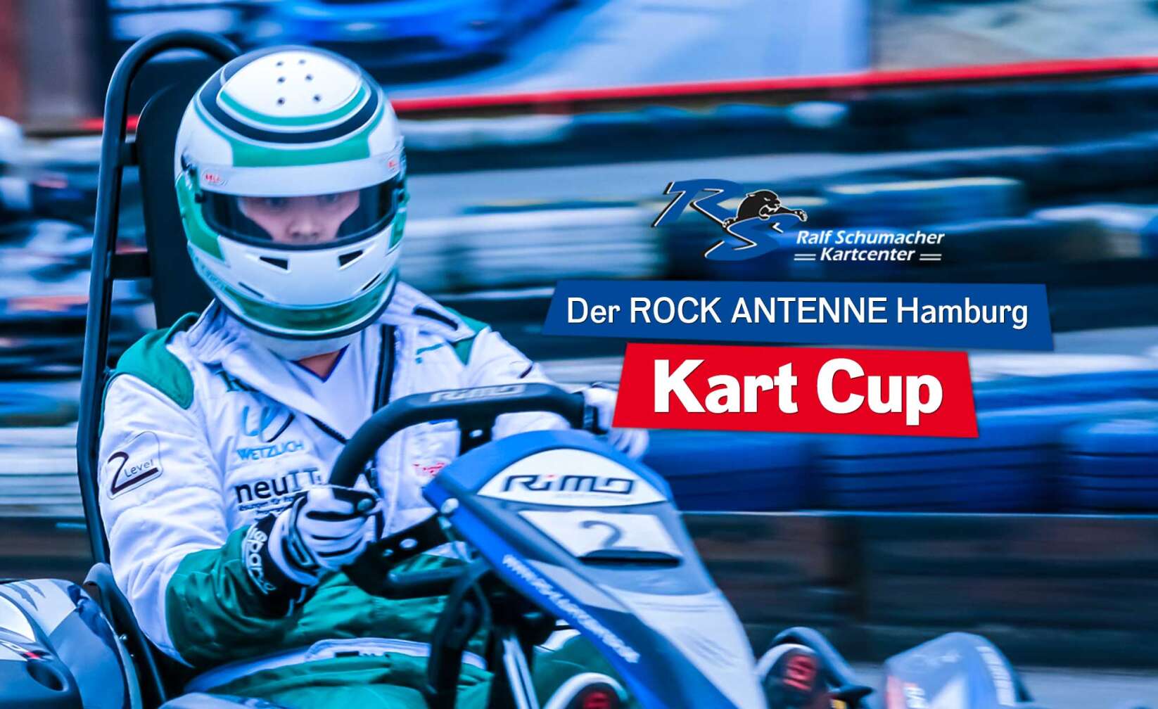 Bild von Kart Fahrer mit verschwommenem Hintergrund