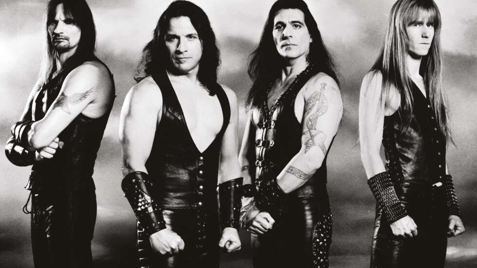Bandmitglieder der Heavy Metal Band Manowar posieren im Lederoutfit